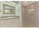Bright bathroom with a glass enclosed shower, a single sink vanity with lots of storage at 233 Rotonda Cir, Rotonda West, FL 33947