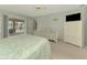 Bedroom with pool views, light walls, and beds dressed in pretty floral bedding at 233 Rotonda Cir, Rotonda West, FL 33947