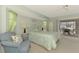Bedroom with views to a patio through sliding glass doors and a bed dressed in floral bedding at 233 Rotonda Cir, Rotonda West, FL 33947