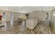 Expansive open floor plan with a kitchen island, stainless appliances, and comfortable living area at 233 Rotonda Cir, Rotonda West, FL 33947