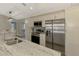 Modern kitchen boasts stainless steel appliances, ample cabinet space, and sleek countertops at 233 Rotonda Cir, Rotonda West, FL 33947
