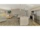 Open kitchen and living area features an island with bar seating and stainless appliances at 233 Rotonda Cir, Rotonda West, FL 33947
