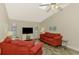 Comfortable living room with vaulted ceiling, modern flooring, and natural light at 233 Rotonda Cir, Rotonda West, FL 33947