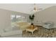 Comfortable living room featuring modern flooring, neutral walls, and ample natural light at 233 Rotonda Cir, Rotonda West, FL 33947
