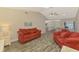 Bright, open-concept living area seamlessly connecting to dining and kitchen space at 233 Rotonda Cir, Rotonda West, FL 33947