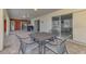 Outdoor patio area with seating and sliding doors to the interior of the house at 233 Rotonda Cir, Rotonda West, FL 33947