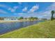 Picturesque waterfront view displaying peaceful canal waters, lush greenery, and charming modern homes under bright sky at 233 Rotonda Cir, Rotonda West, FL 33947