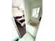 Bathroom with single sink and vanity situated near bedroom at 235 Trailorama Dr, North Port, FL 34287
