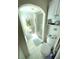 Bathroom featuring shower stall with glass door and built in shelving and cabinets at 235 Trailorama Dr, North Port, FL 34287
