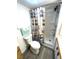 Bathroom features shower stall with built in shelving and a lighthouse themed shower curtain at 235 Trailorama Dr, North Port, FL 34287