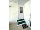 Exterior entryway featuring two green steps and a white door at 235 Trailorama Dr, North Port, FL 34287