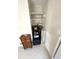 Hallway with storage shelf and cabinet at 235 Trailorama Dr, North Port, FL 34287