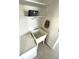 Laundry area sink with storage bench and shelf at 235 Trailorama Dr, North Port, FL 34287