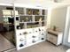 Bright living room showcasing a large built-in shelf displaying decorative items and decor at 235 Trailorama Dr, North Port, FL 34287