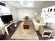 Inviting living room with stylish décor, wood-look flooring, and comfortable seating arrangement at 235 Trailorama Dr, North Port, FL 34287