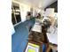 Bright sunroom with a desk and view of the interior at 235 Trailorama Dr, North Port, FL 34287
