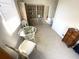 Cozy sunroom with a round table, wicker chairs, and built-in bookcase at 235 Trailorama Dr, North Port, FL 34287