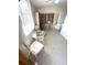 Cozy sunroom with a round table, wicker chairs, and built-in bookcase at 235 Trailorama Dr, North Port, FL 34287
