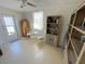 Cozy sunroom with a round table, wicker chairs, and built-in bookcase at 235 Trailorama Dr, North Port, FL 34287