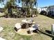 Backyard with stone picnic table at 235 Trailorama Dr, North Port, FL 34287