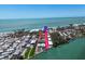 An aerial view shows this beachfront property with beach access on the bay at 2405 N Beach Rd # 4, Englewood, FL 34223
