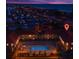 Aerial view of complex with a pool and ocean view with a sunset in the background at 2405 N Beach Rd # 4, Englewood, FL 34223