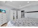 Cozy bedroom featuring a dresser, closet, and laundry area with a serene coastal theme at 2405 N Beach Rd # 4, Englewood, FL 34223