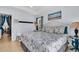 Comfortable bedroom with coastal decor, closet, and stylish furnishings for a relaxing retreat at 2405 N Beach Rd # 4, Englewood, FL 34223