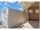 Exterior view of a complex with a white privacy fence and bike rack at 2405 N Beach Rd # 4, Englewood, FL 34223