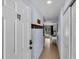 Inviting condo hallway leading to a bright living area with natural light and closet at 2405 N Beach Rd # 4, Englewood, FL 34223