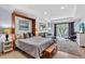 Open living area with a Murphy bed, comfortable seating, and a sliding door leading to a balcony at 2405 N Beach Rd # 4, Englewood, FL 34223