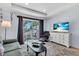 Comfortable living room with a large sliding door to the balcony and a plush recliner at 2405 N Beach Rd # 4, Englewood, FL 34223
