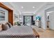 Open floorplan featuring a Murphy bed, sofa, entertainment center and access to the balcony at 2405 N Beach Rd # 4, Englewood, FL 34223
