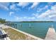 Beautiful waterfront view with docks and benches, perfect for enjoying the serene scenery and outdoor activities at 2405 N Beach Rd # 4, Englewood, FL 34223