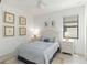 Charming bedroom with a full-size bed, and white nightstands at 24153 Spartina Dr, Venice, FL 34293