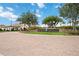 Community entrance displaying the Sarasota National sign with brick pavers and landscaping at 24153 Spartina Dr, Venice, FL 34293