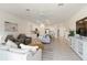 Open living room featuring recessed lighting, tile flooring, and a white ceiling fan at 24153 Spartina Dr, Venice, FL 34293