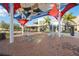 Charming outdoor seating area with colorful awnings, perfect for enjoying the vibrant community atmosphere at 24153 Spartina Dr, Venice, FL 34293