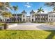 Elegant town center with stylish architecture, palm trees, and well-manicured lawns in a vibrant setting at 24153 Spartina Dr, Venice, FL 34293