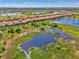 Scenic Sarasota National community view with lush landscaping and serene water feature views at 24193 Gallberry Dr, Venice, FL 34293
