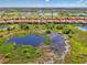 Beautiful Sarasota National homesite overlooking the expansive water feature and lush greenery at 24193 Gallberry Dr, Venice, FL 34293