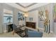 Sitting area with decorative artwork, neutral paint, and tile floor at 24193 Gallberry Dr, Venice, FL 34293