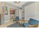 Sitting room boasts elegant lighting, stylish decor, and ample closet space at 24193 Gallberry Dr, Venice, FL 34293