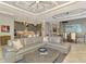 Open living space connects kitchen, dining, and living areas; featuring tile floors and modern decor at 24193 Gallberry Dr, Venice, FL 34293