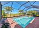 Beautiful pool with a screened enclosure and lush landscaping to provide the perfect outdoor oasis at 24193 Gallberry Dr, Venice, FL 34293
