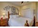 Comfortable bedroom featuring a decorative wrought iron bed frame and a relaxing ambiance at 2542 Cortenova Ct, Venice, FL 34292