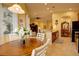 Charming breakfast nook with a round table, comfortable seating, and plenty of natural light from surrounding windows at 2542 Cortenova Ct, Venice, FL 34292