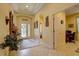 Inviting foyer leading to a bedroom and an entryway with a view of the front door at 2542 Cortenova Ct, Venice, FL 34292