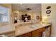 Well-appointed kitchen with stainless steel appliances, plenty of countertop space, and seamless flow into the living area at 2542 Cortenova Ct, Venice, FL 34292