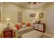 A cozy sitting room with a decorative fireplace and plenty of natural light at 2542 Cortenova Ct, Venice, FL 34292